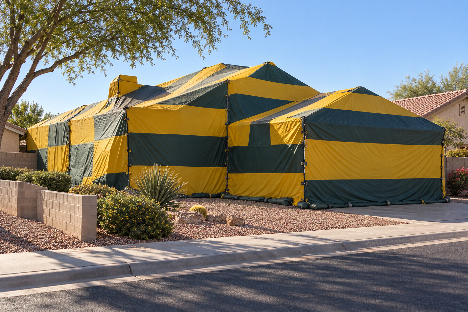 House covered by a striped fumigation tent